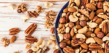 A bowl of different nuts, including almonds, walnuts, cashews and more.