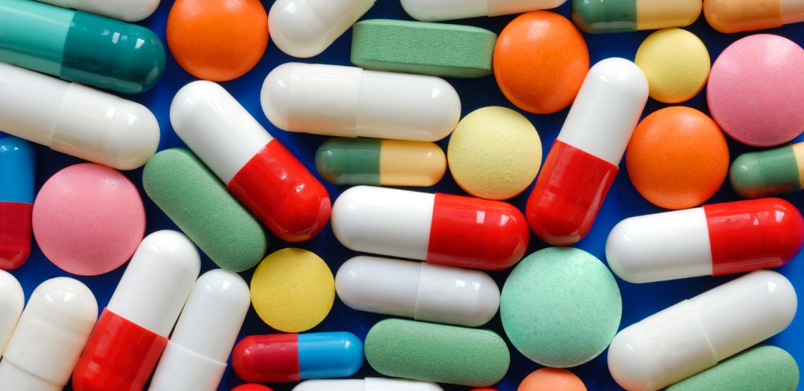 A variety of different colored pills.