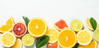 A variety of citrus fruits cut into slices.
